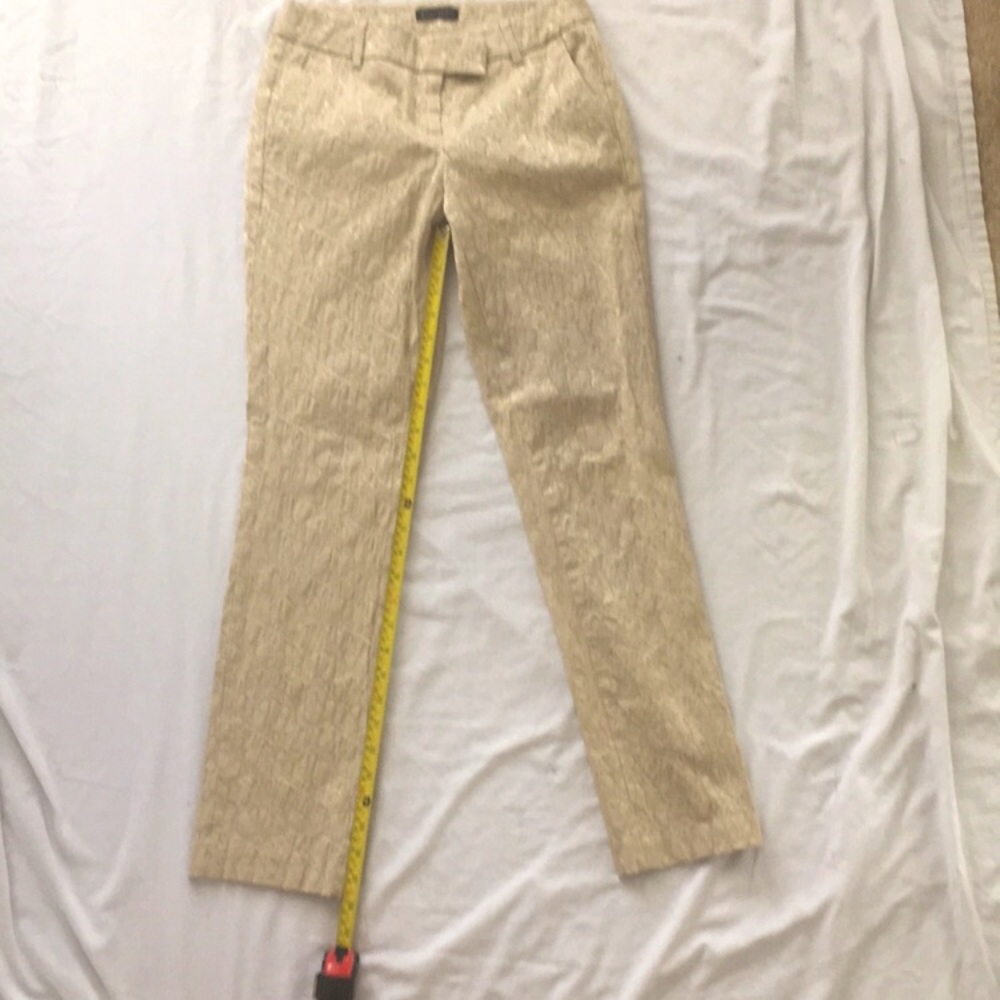 Will Smith cream/tan textured thick pants with metallic accents.